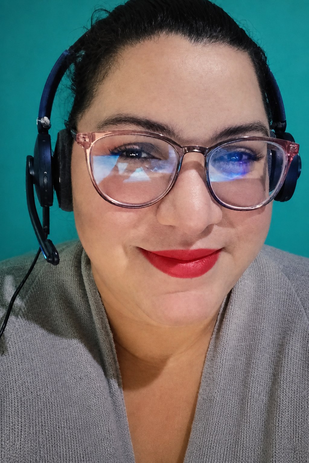 Aura Bravo, General Manager of Dealers in Drive, on a headset