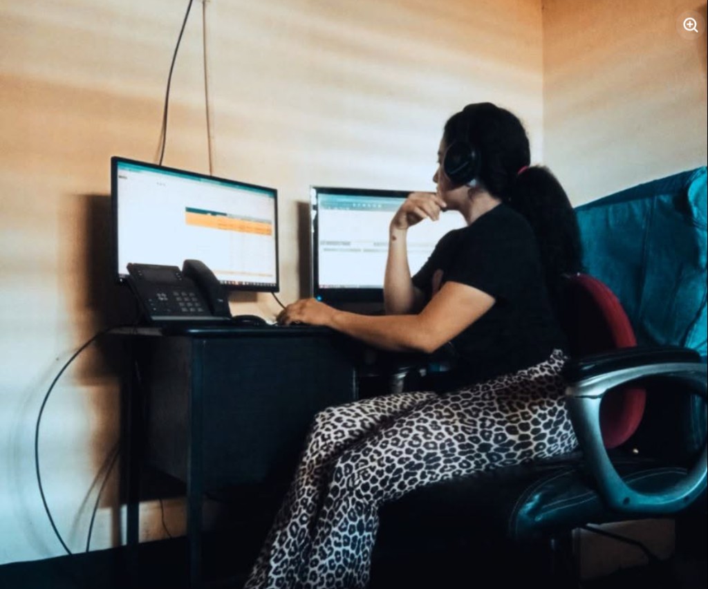 A Dealers in Drive agent at a dual-monitor workstation